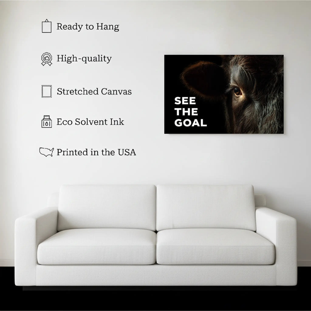See The Goal Bull Wall Art canvas hanging on a living room wall above a white sofa