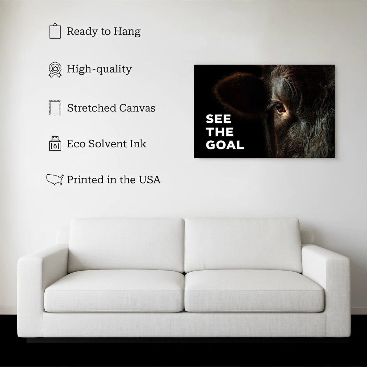 See The Goal Bull Wall Art canvas hanging on a living room wall above a white sofa