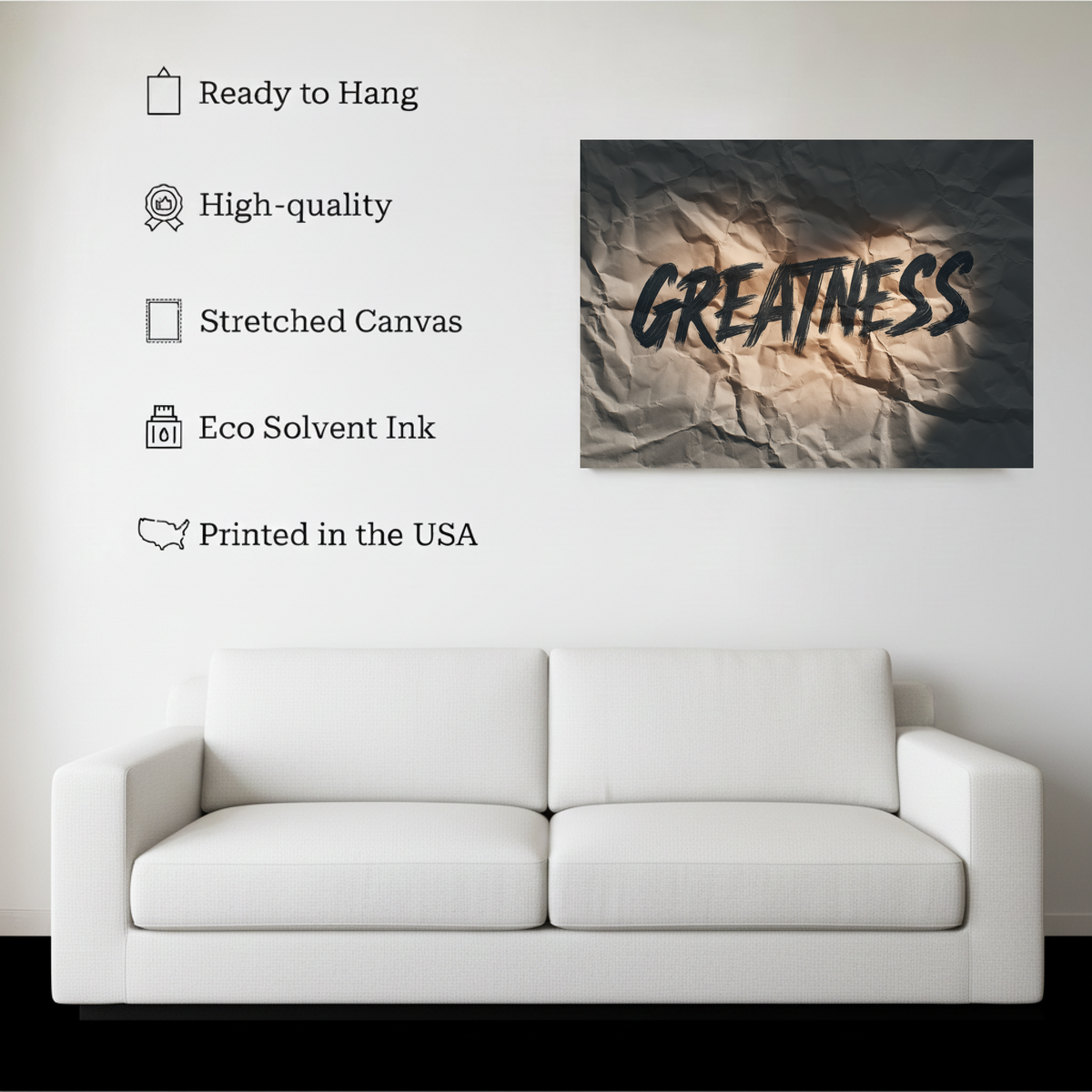 Greatness Motivational Wall Art canvas hanging on a living room wall above a white sofa