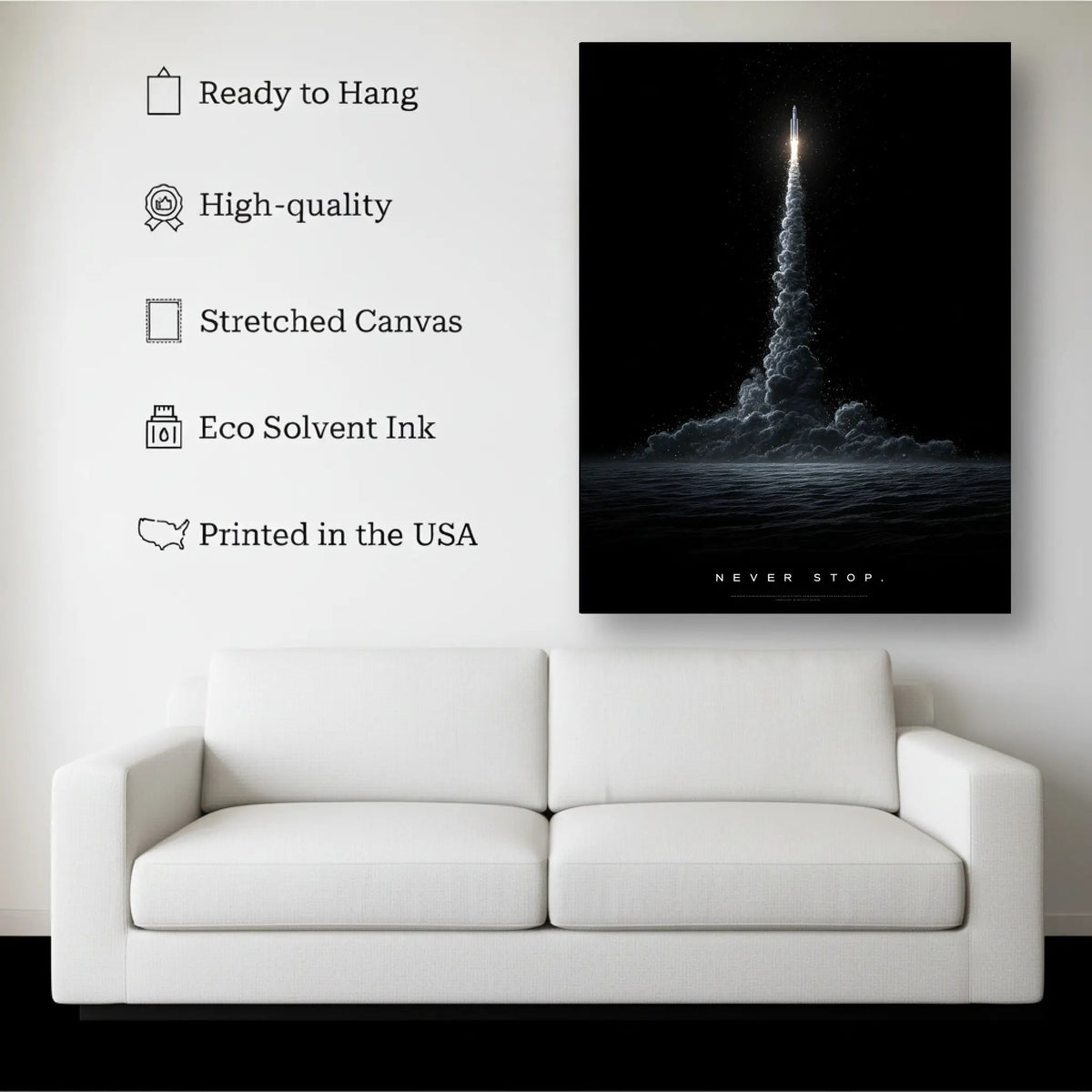 Never Stop canvas hanging on a living room wall above a white sofa